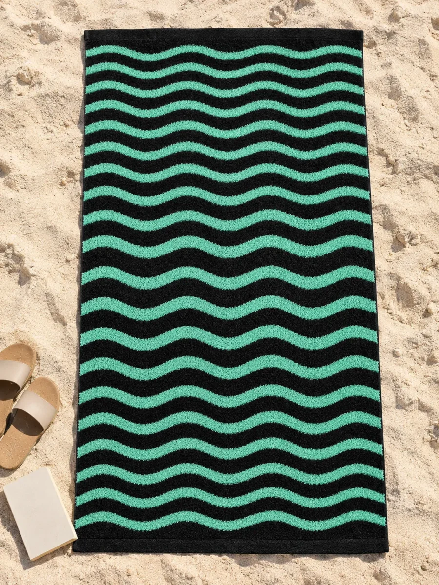 Ripple Beach Towel spread out on the sand
