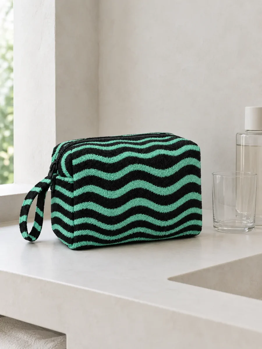Ripple Zip Wash Bag on a bathroom shelf (other items not included)