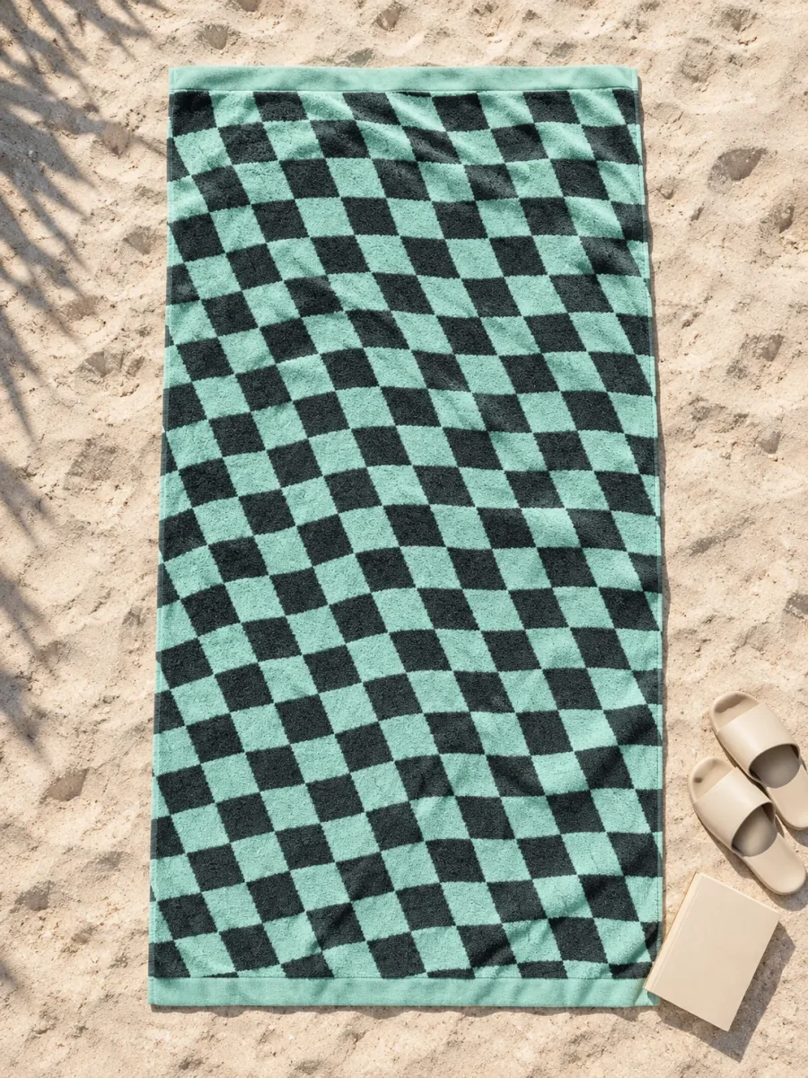 Warp Beach Towel spread out on the sand